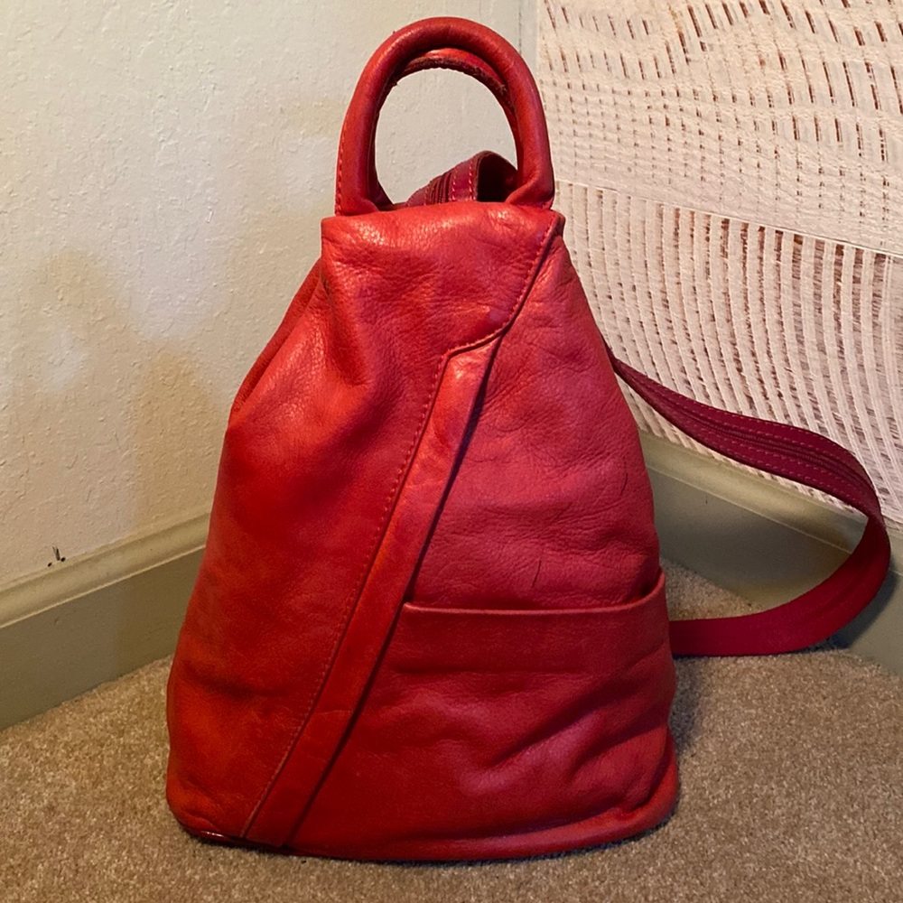Red Leather bag/backpack. Measures 15 inches tall to top of handles